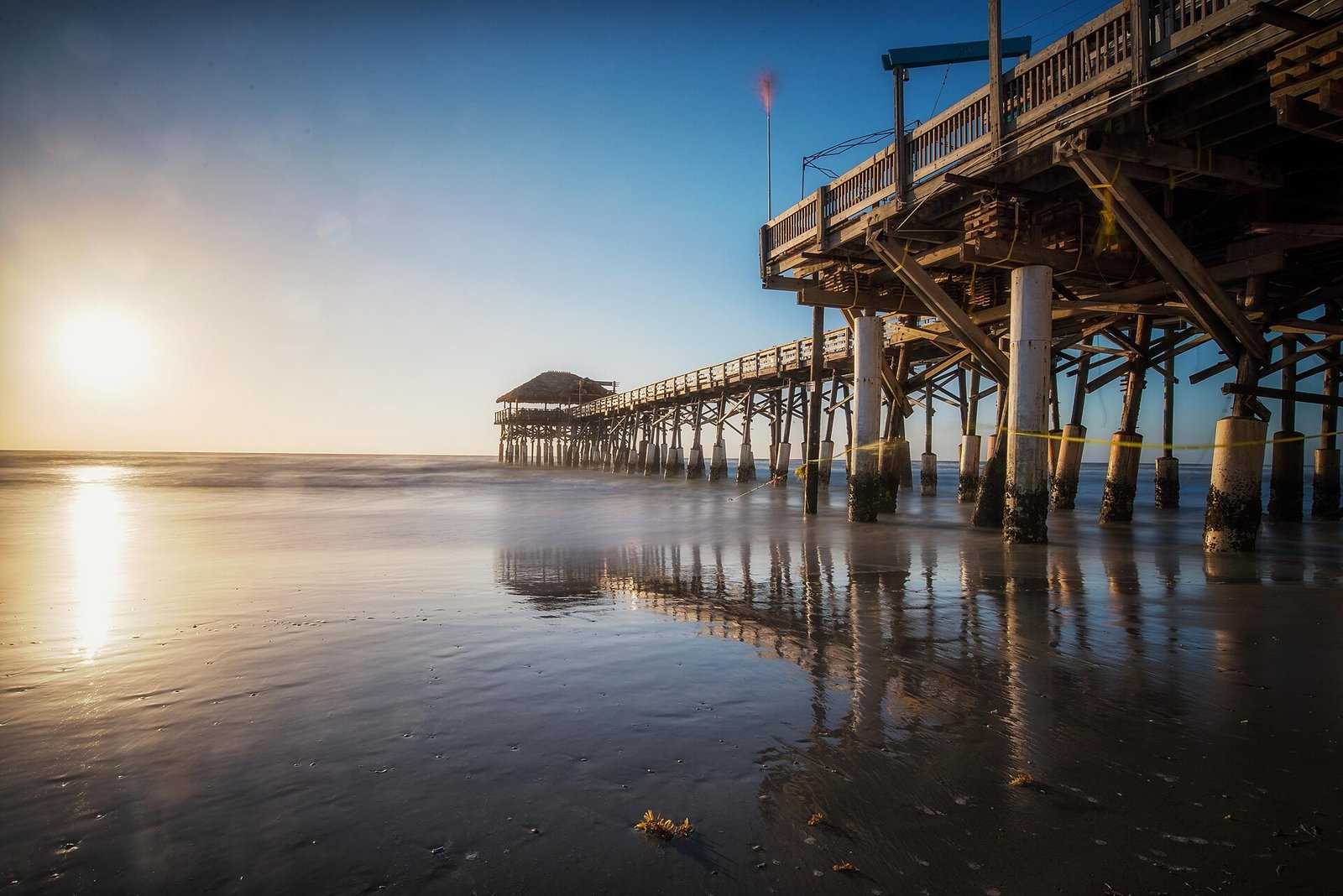 Early light over a wooden pier and calm water